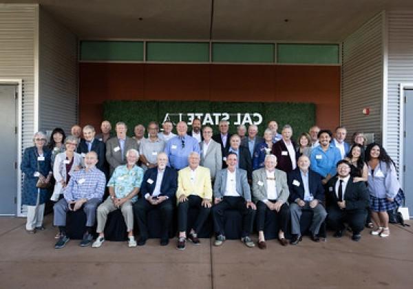 Group of Sigma Nu Alumni posing for group photo. 